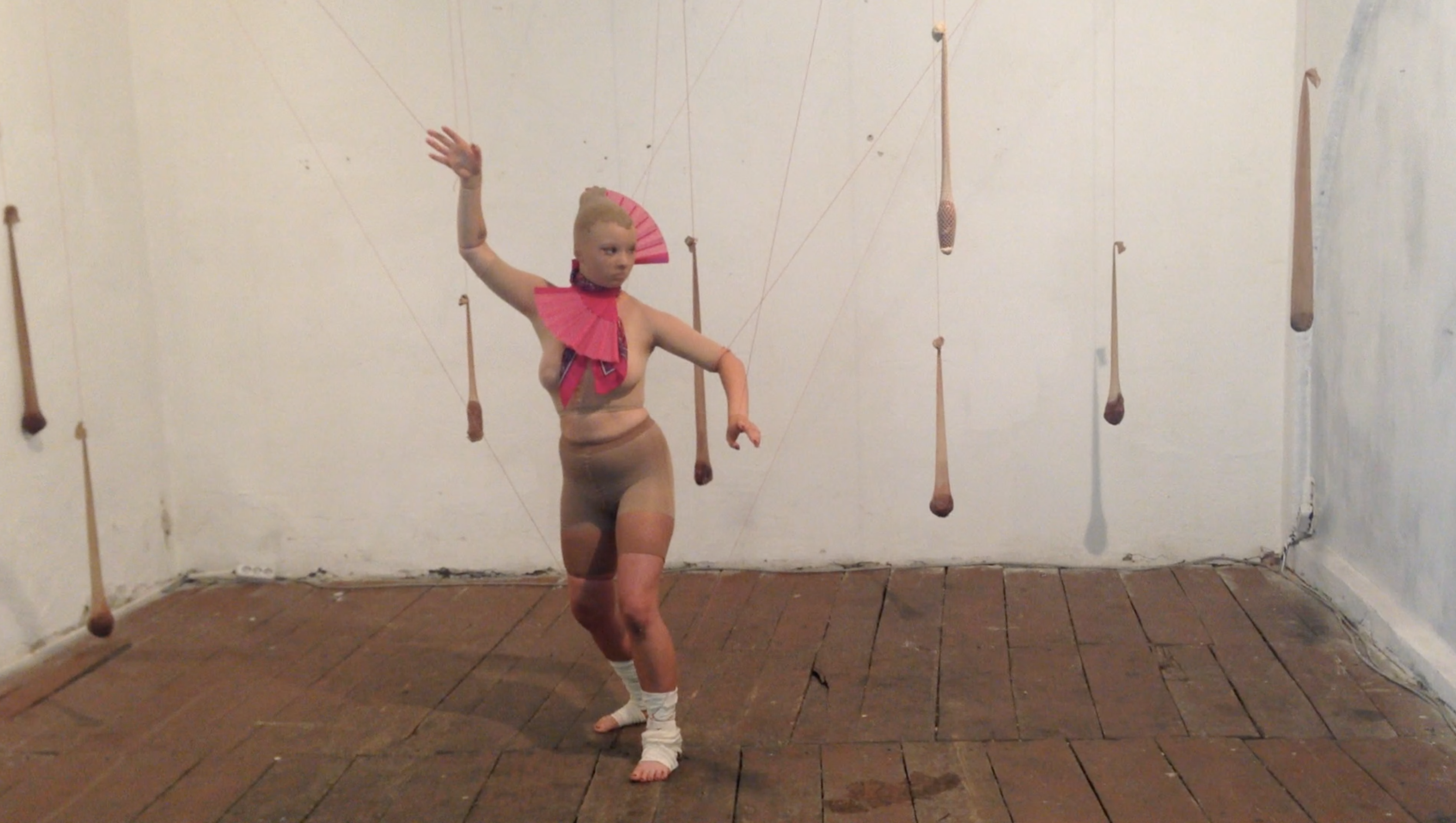Performer moving through the installation in Body of a Home